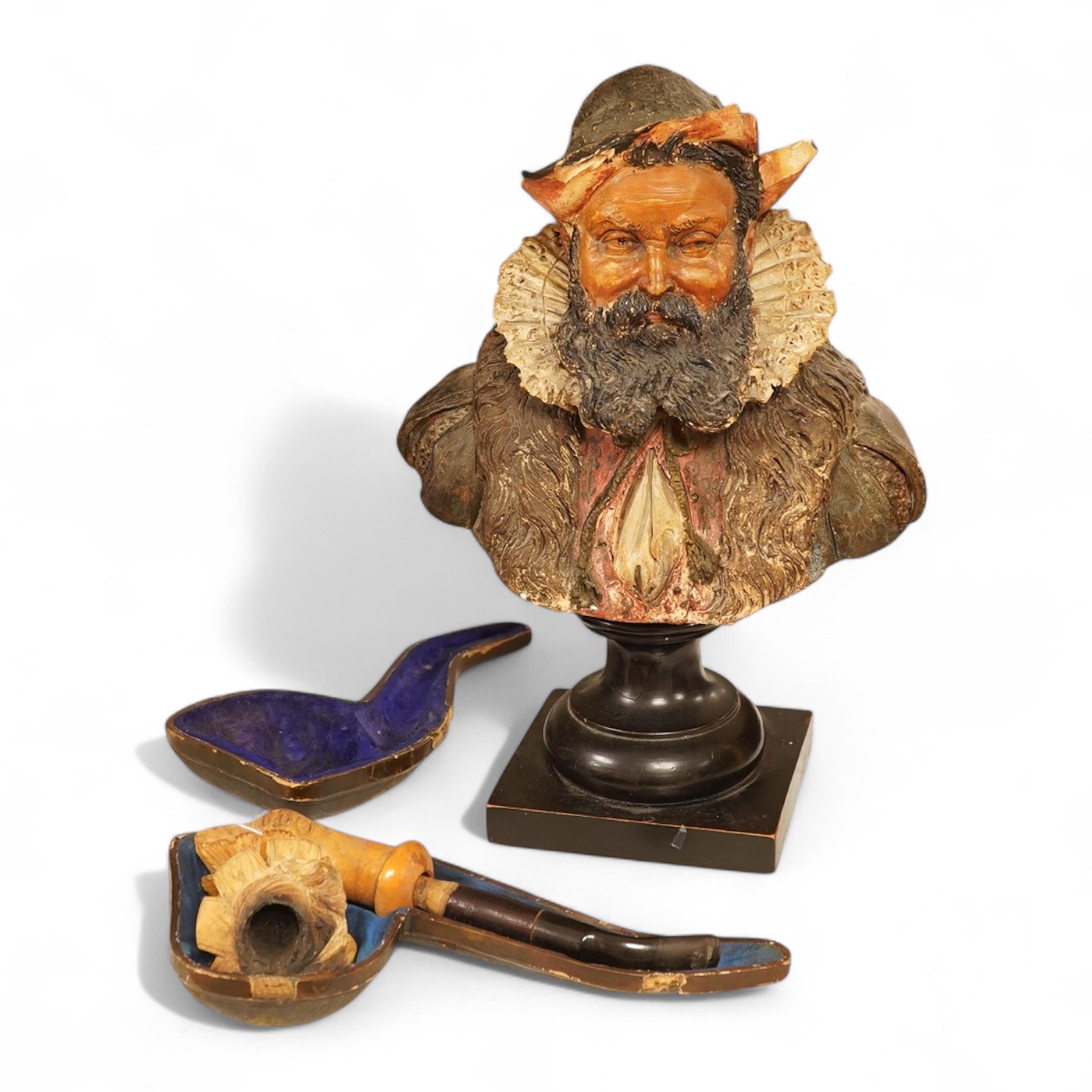 A 19th century German cold-painted terracotta bust, on ebonised socle and a Meerschaum pipe in case, bust 27cm high